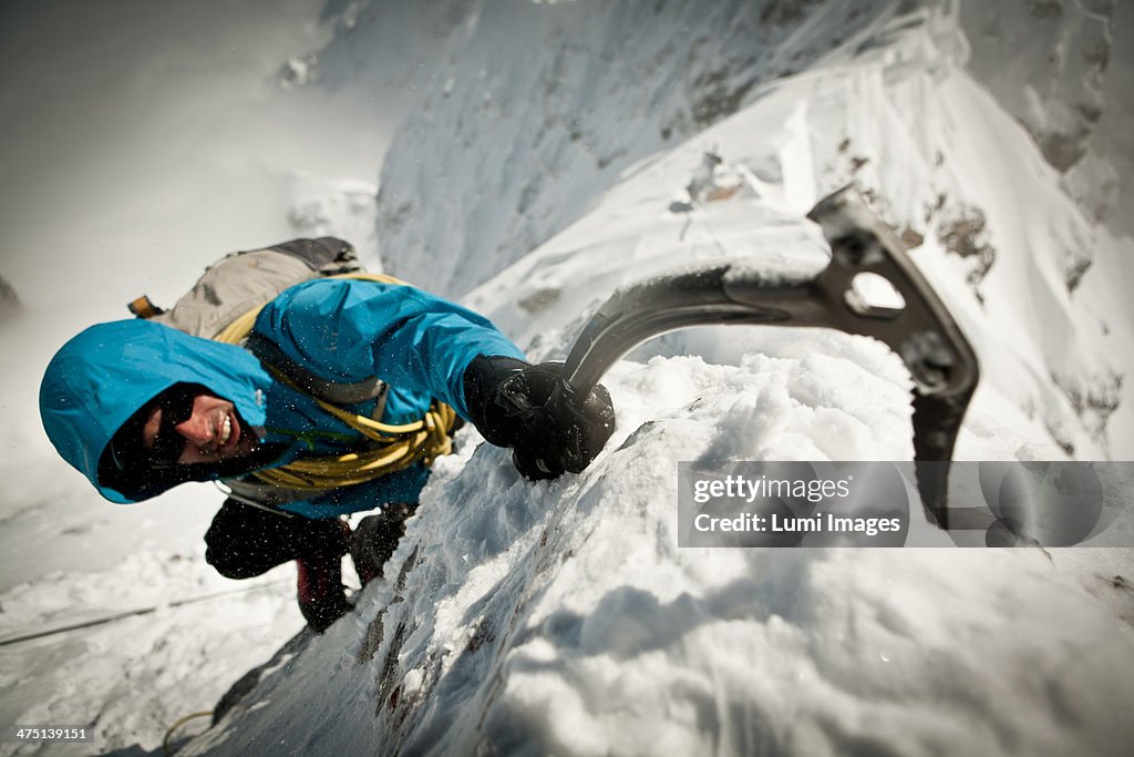 Alpinist ice climbing, on the rope, Zugspitze Mountain, Bavaria, Germany