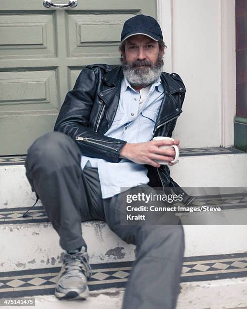 mature man sitting on steps - doorstep stock pictures, royalty-free photos & images