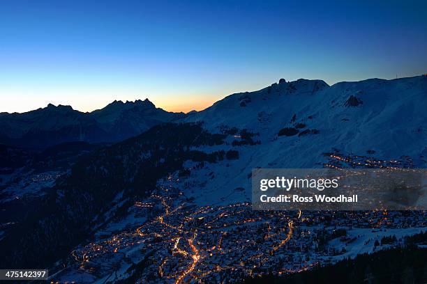 town in mountains at night, verbier, switzerland - verbier ストックフォトと画像