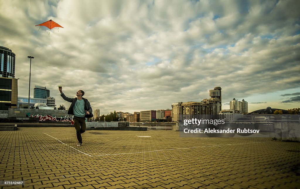 Young man flying kite, Russia