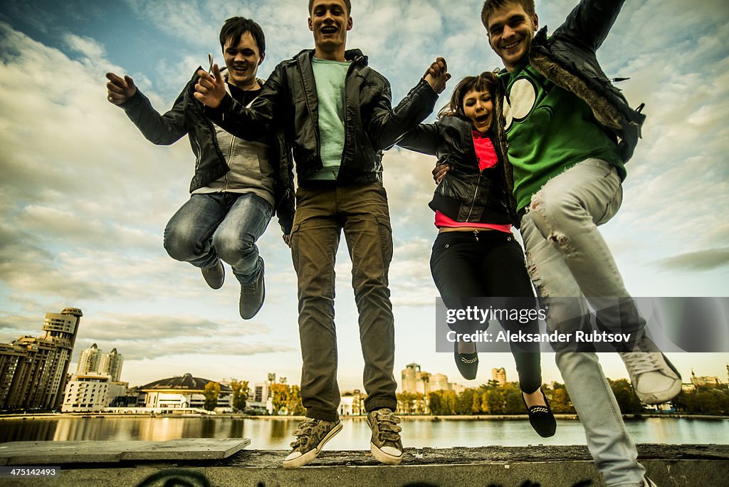 Four friends jumping mid air, Russia