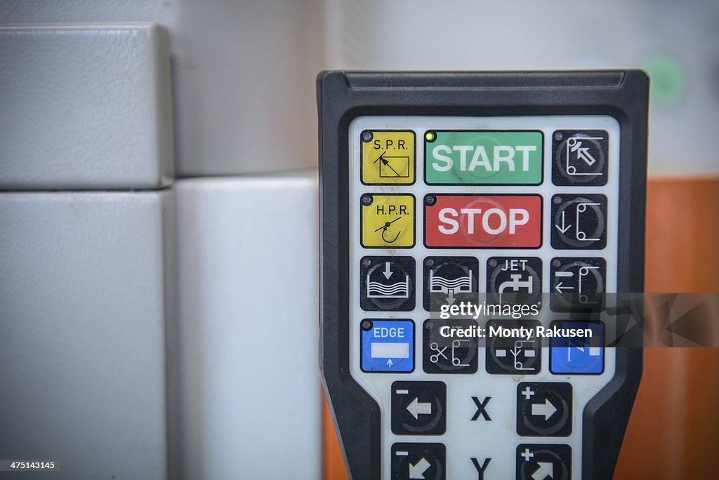 Machinery control pad in factory, close up