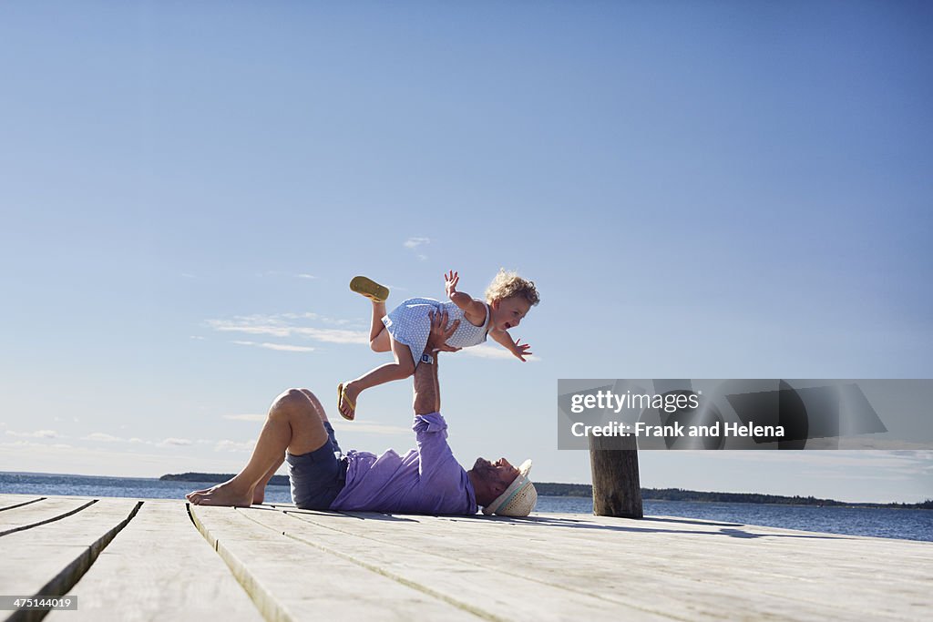 Female toddler and father playing, Utvalnas, Gavle, Sweden
