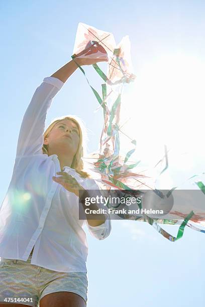 young woman holding kite, utvalnas, gavle, sweden - kite flying stock pictures, royalty-free photos & images