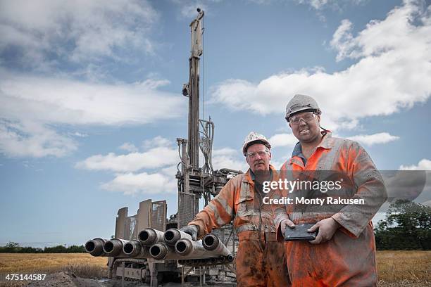 portrait of drilling rig workers in hard hats and workwear - mining hats stock pictures, royalty-free photos & images