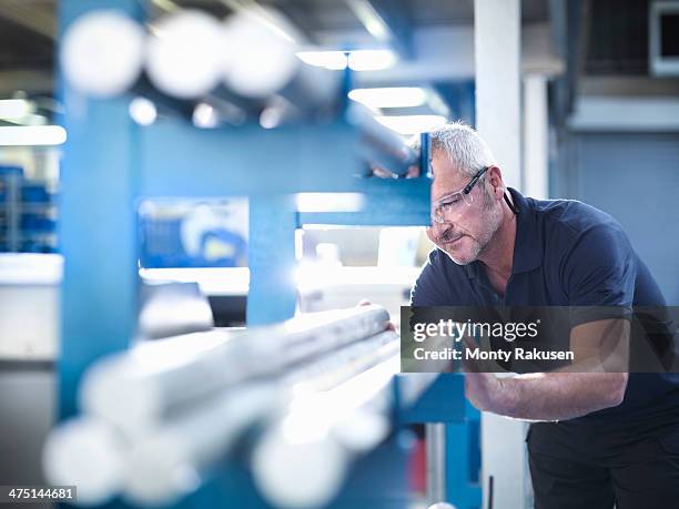 engineer working with aluminium in factory - selektivt fokus bildbanksfoton och bilder