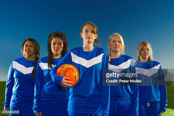 portrait of female football team, young woman holding ball - football team stock pictures, royalty-free photos & images