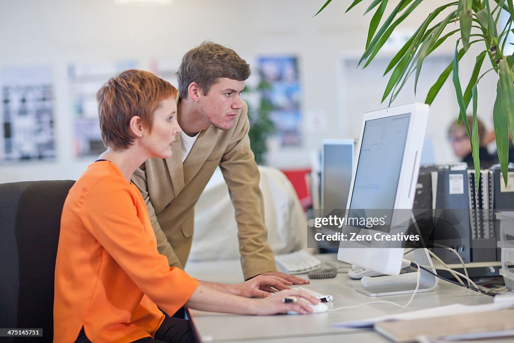 Businesspeople using computer