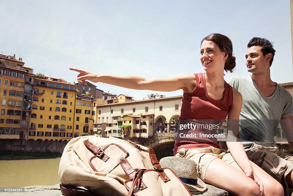Man and woman by Ponte Vecchio, Florence, Tuscany, Italy