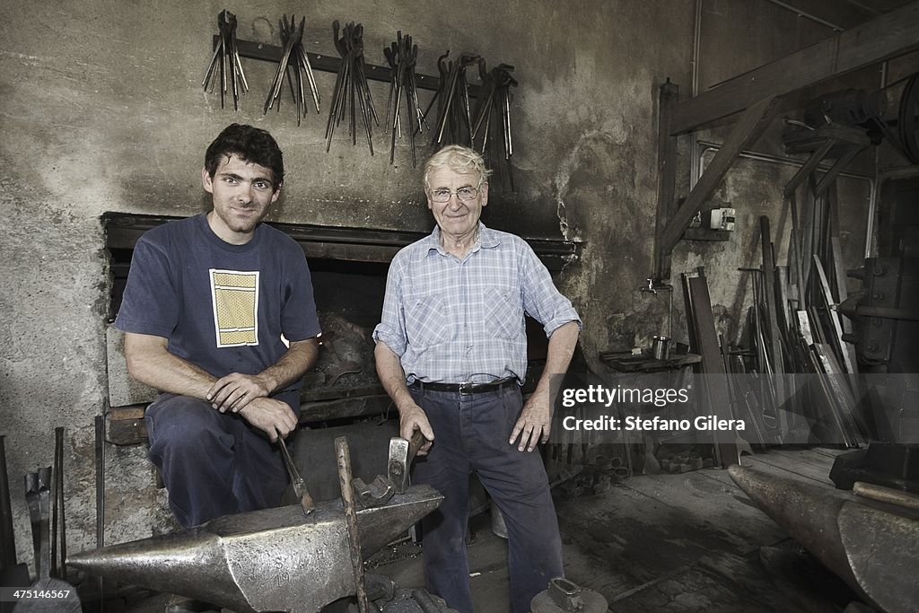 Portrait of blacksmiths in workshop