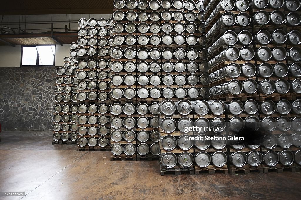 Casks of beer stacked in a brewery