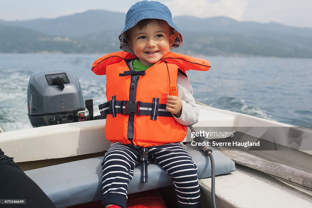 Boy enjoying boat ride