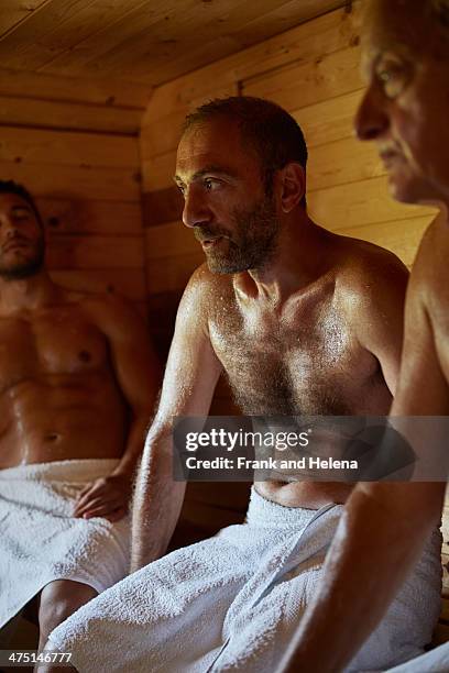 close up of three men sitting in sauna - sauna stock-fotos und bilder