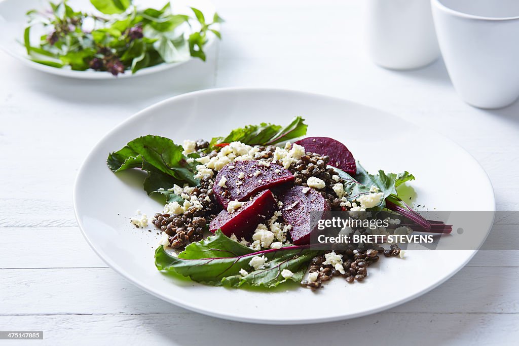 Still life of lentil, beetroot and feta salad