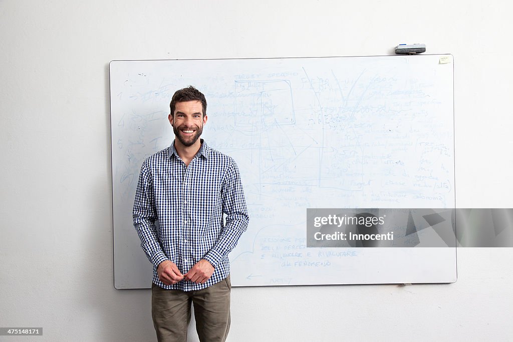 Businessman in front of whiteboard