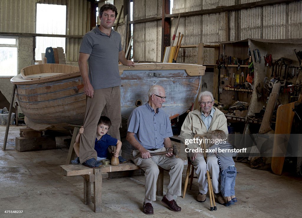 Group portrait of four generations of male boat builders