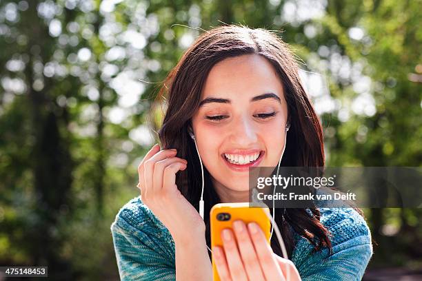 Portrait Of Young Woman Listening To Music, Foto de stock