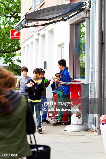 boys and students eating fast food at lunchtime - chips essen stock pictures, royalty-free photos & images