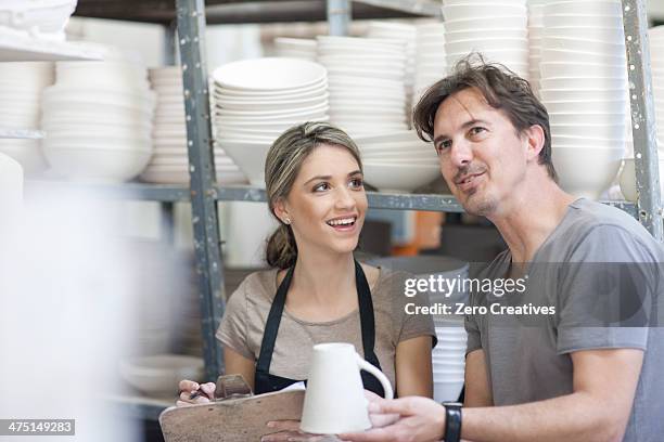 potters chatting at crockery factory - 40 44 years blond hair mature man factory stock pictures, royalty-free photos & images