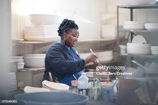 potter preparing paint at crockery factory - africa craft bildbanksfoton och bilder