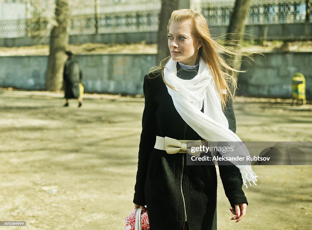 Fashionable young woman in park