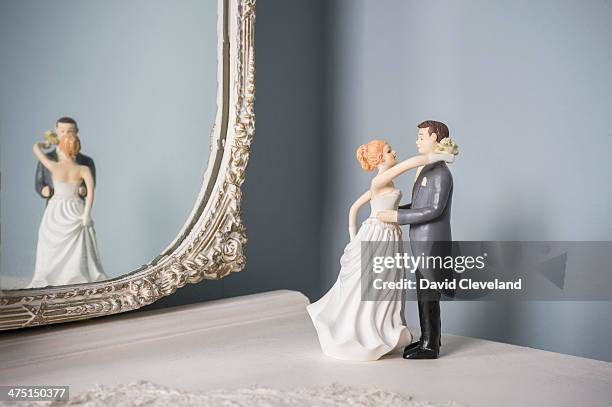 wedding figurines and wall mirror - dressing table wall stock pictures, royalty-free photos & images
