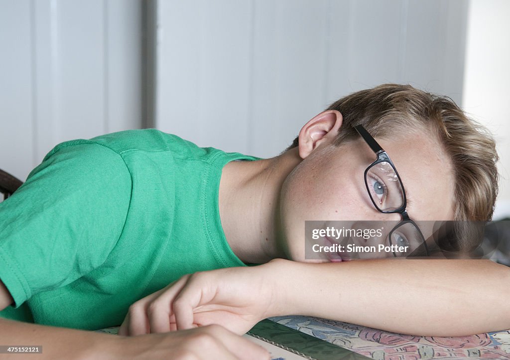 Portrait of teenage boy looking bored