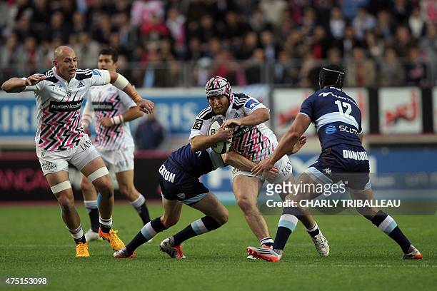 Stade Francais' French hooker Remi Bonfils tries to break through Racing Metro's defence during the French rugby union Top 14 Play-Off match beetween...