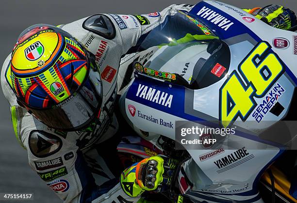 Yamaha Factory Racing rider Valentino Rossi of Italy steers his bike during the second day of the second MotoGP pre-season test at the Sepang circuit...