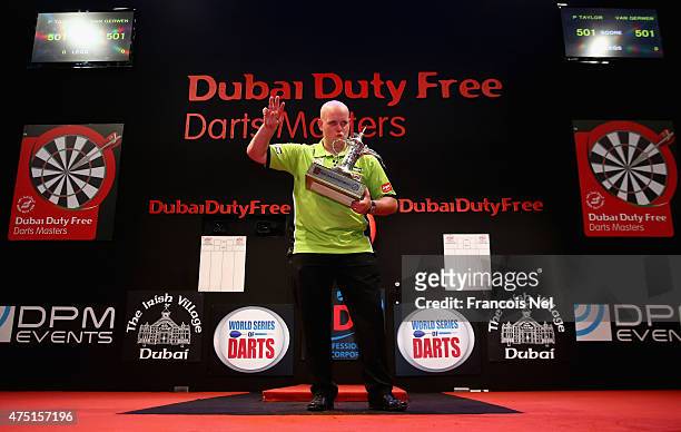 Michael Van Gerwen of the Netherlands celebrates after winning the 2015 Dubai Duty Free Darts Masters at Dubai Duty Free Tennis Stadium on May 29,...