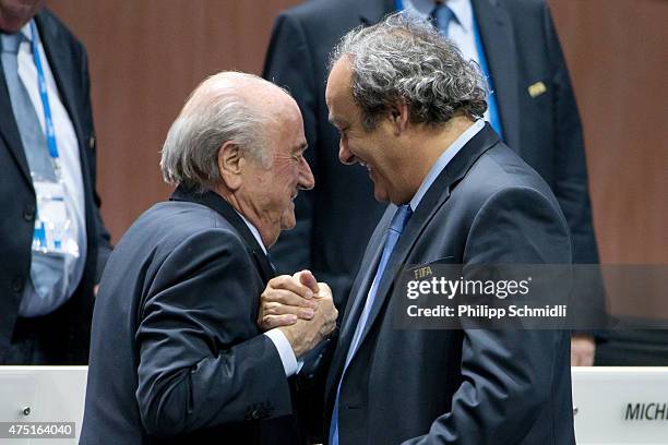 President Joseph S. Blatter shakes hands with UEFA president Michel Platini during the 65th FIFA Congress at Hallenstadion on May 29, 2015 in Zurich,...