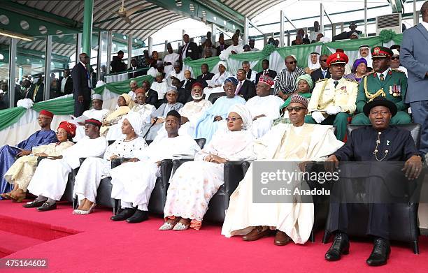 Nigerian president Muhammadu Buhari sits with Vice President-elect Yemi Osinbajo , Aisha Buhari, the new first lady of Nigeria and outgoing president...