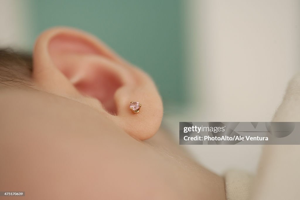 Close-up of baby's ear, cropped