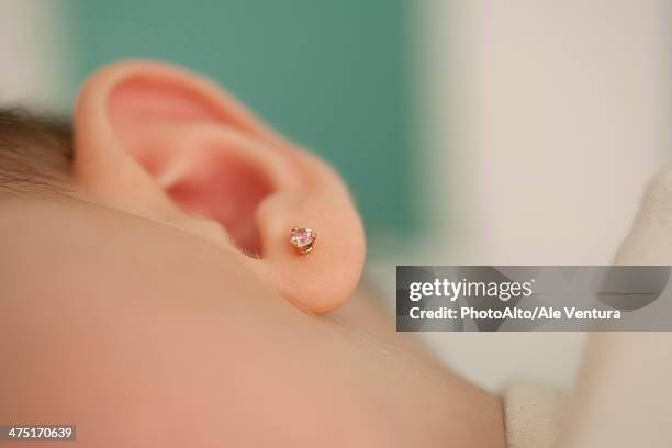 close-up of baby's ear, cropped - earring fotografías e imágenes de stock