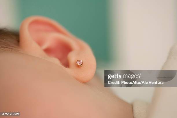 close-up of baby's ear, cropped - boucle d'oreille photos et images de collection