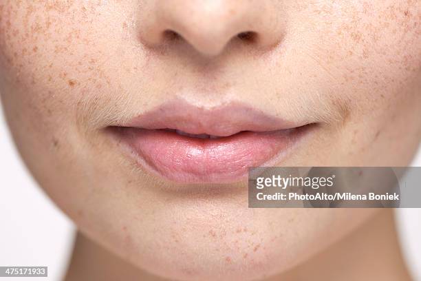 close-up of young woman's face and lips - mouth fotografías e imágenes de stock
