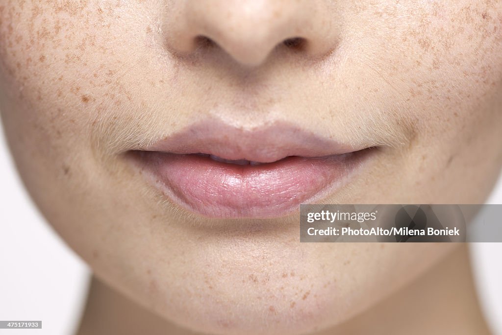 Close-up of young woman's face and lips