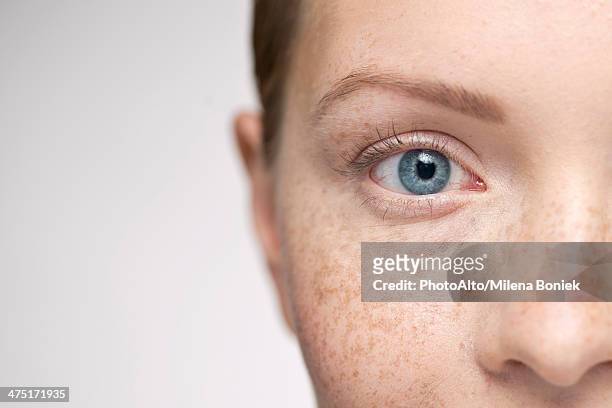 young woman, close-up portrait - faces freckles stock pictures, royalty-free photos & images