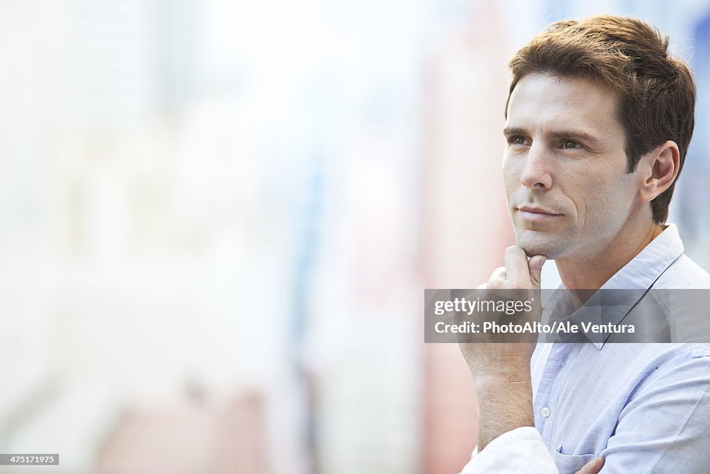 Mid-adult man in thought, portrait