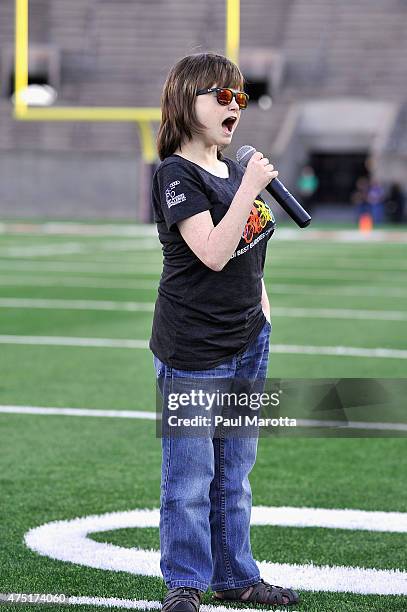 Marlana VanHoose sings the National Anthem at the Tom Brady Football Challenge for The Best Buddies Challenge: Hyannis Port 2015 at Harvard Field on...