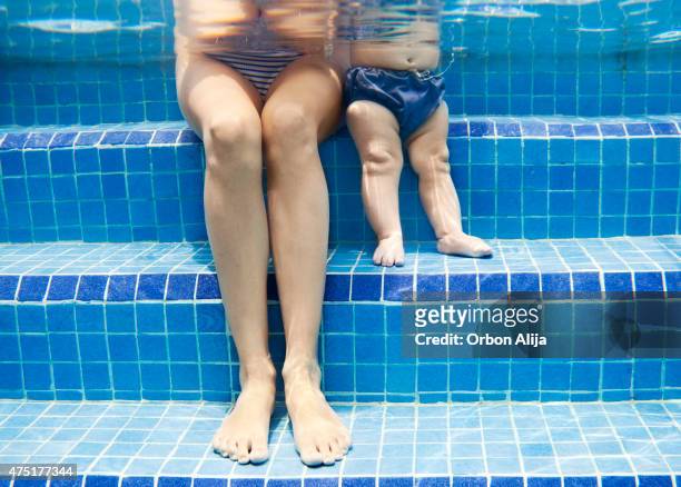 mother and baby on swimming pool - baby body stock pictures, royalty-free photos & images