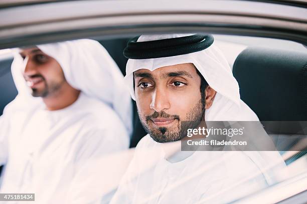 emirati business meeting in the car - emirati man portrait stockfoto's en -beelden