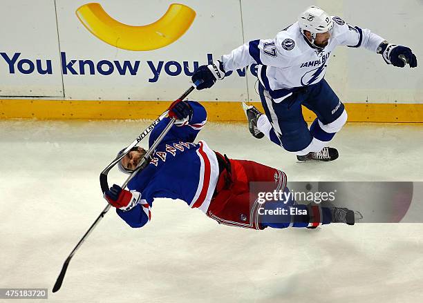 Alex Killorn of the Tampa Bay Lightning collides with Dan Boyle of the New York Rangers in the first period of Game Seven of the Eastern Conference...