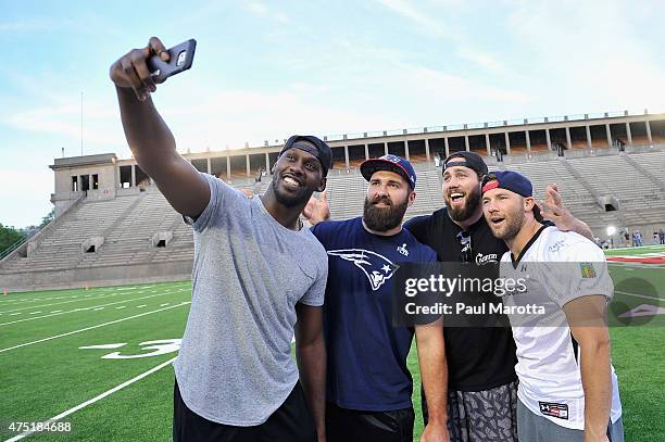 Players Chandler Jones, Rob Ninkovich, Dane Fletcher and Julian Edelman attend the Tom Brady Football Challenge for The Best Buddies Challenge:...