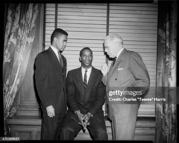 Group portrait of runner Arnold 'Arnie' Sowell, basketball player Sihugo 'Si' Green, and Pittsburgh Mayor David L Lawrence, at Dapper Dan banquet,...