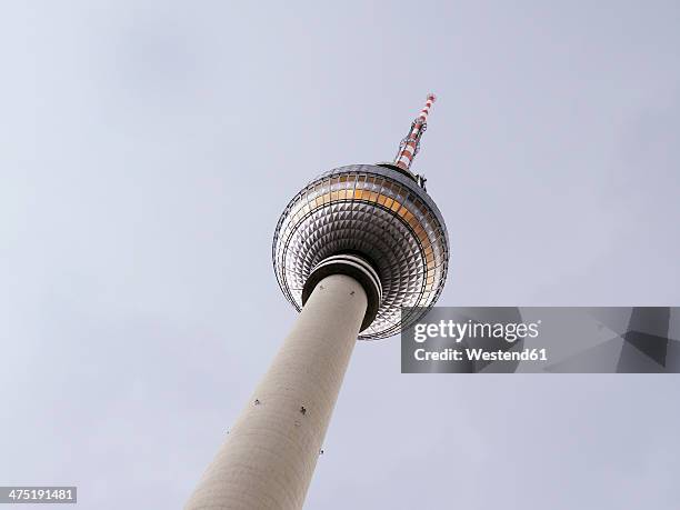 germany, berlin, worms eye view of tv tower at alexanderplatz - berliner fernsehturm stock-fotos und bilder