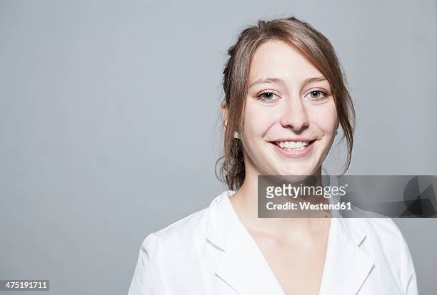 portrait of smiling young woman, close-up - doctor headshot stock pictures, royalty-free photos & images
