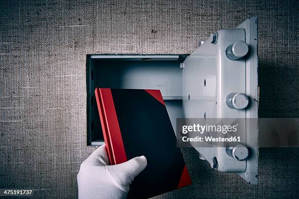 germany, man, safe, book, theft - lock sporting position stock-fotos und bilder