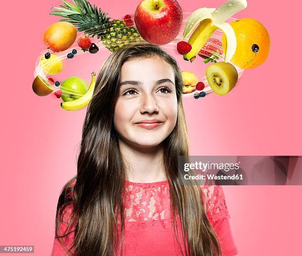 girl with flying fruits around her head, composite - flying kiwi stock pictures, royalty-free photos & images