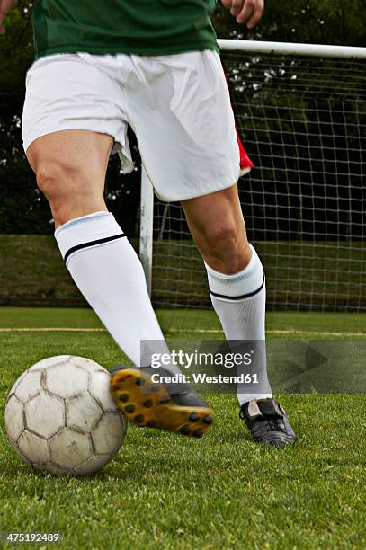 soccer player on field - soccer dribbling stock pictures, royalty-free photos & images